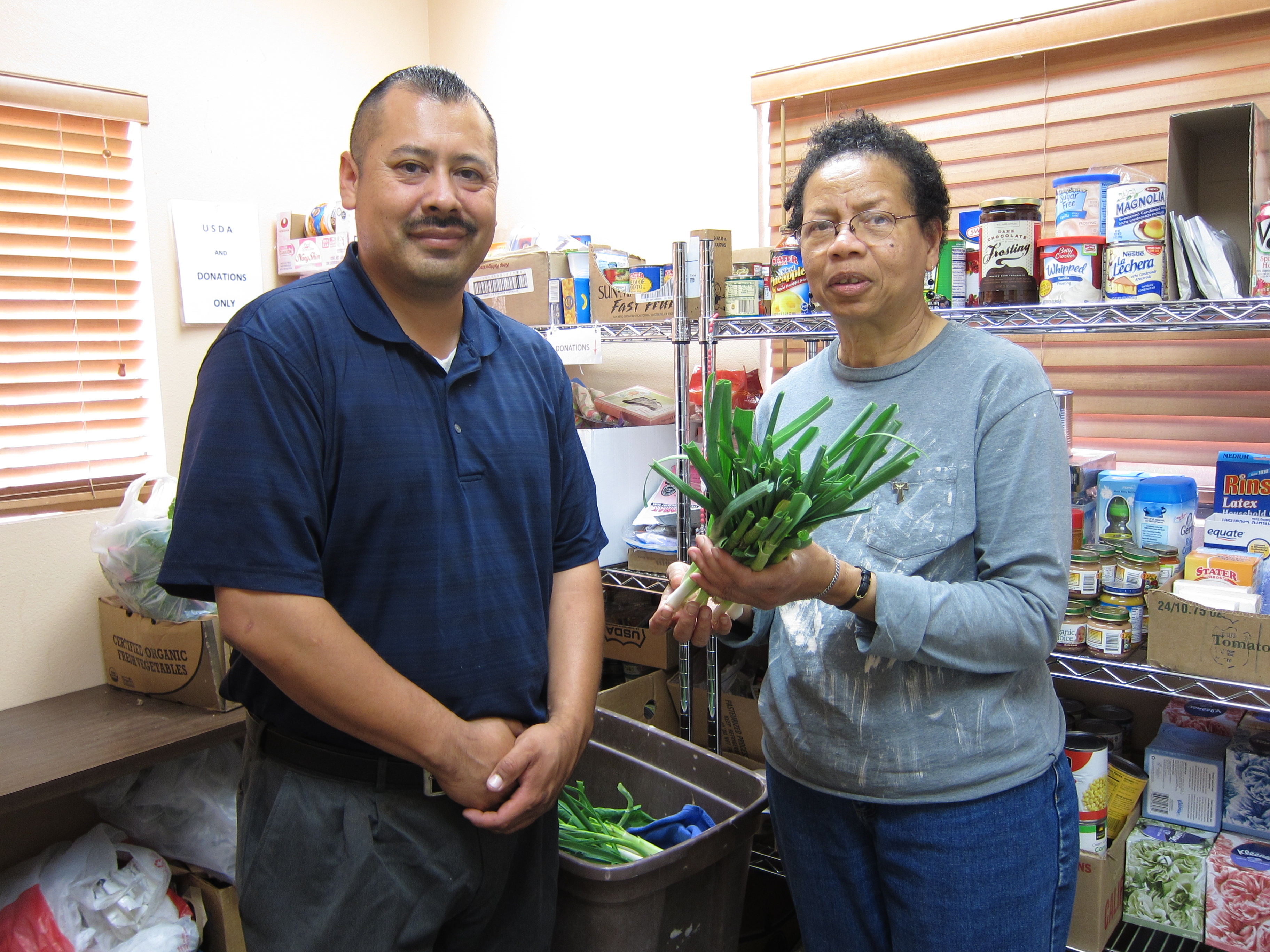 Isaac Vega and Client in Claremont's Hope Partners Food Bank.