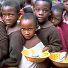 Boys with food bowls in the Ivory Coast.