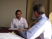 Tim Magee in a workshop on Nonprofit management with a participant